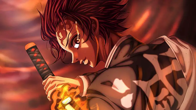 HD wallpaper demon slayer tanjiro kamado having fire sword with blur background anime